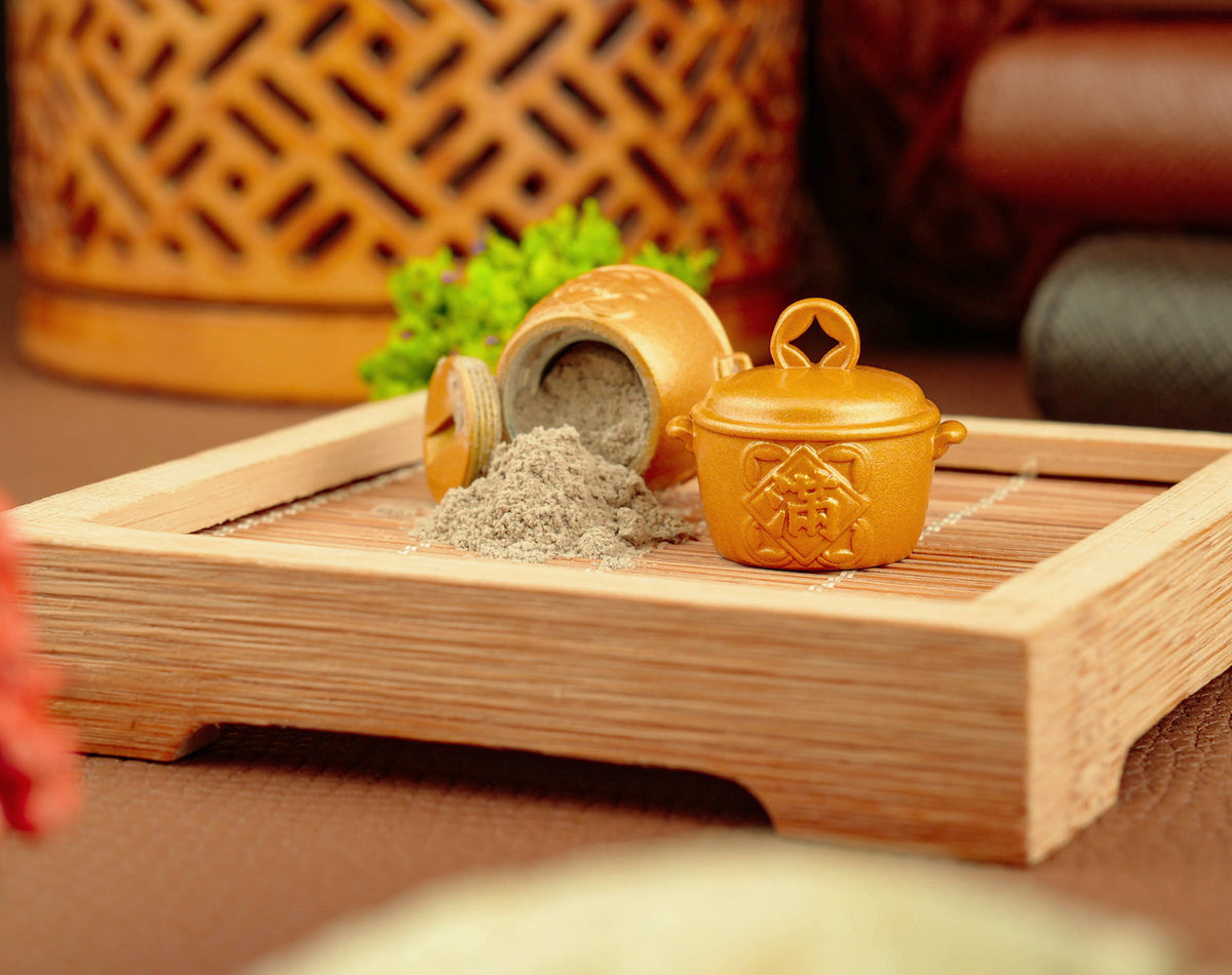 Golden Fortune Pot opened with temple incense ash