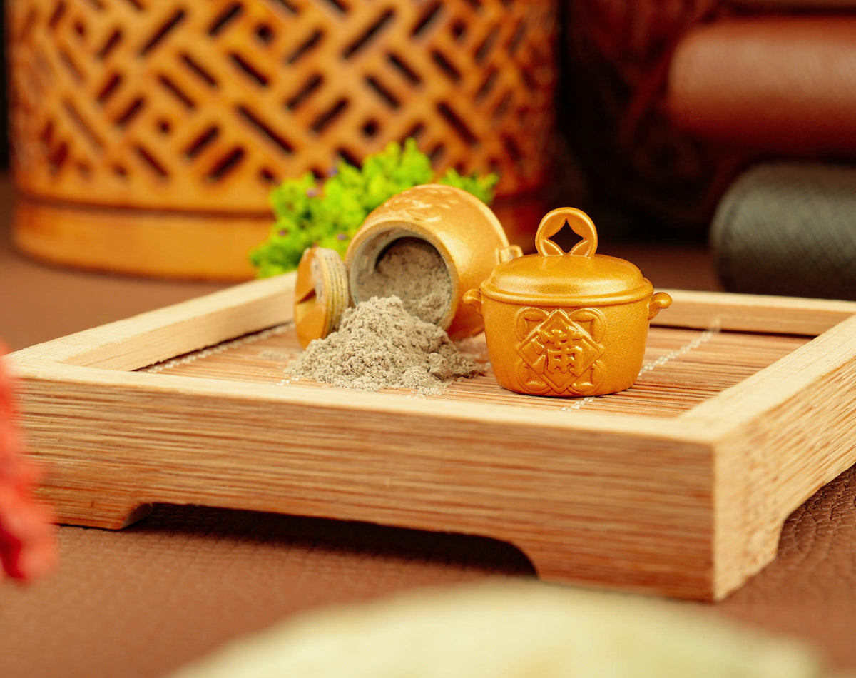 Golden Fortune Pot opened with temple incense ash