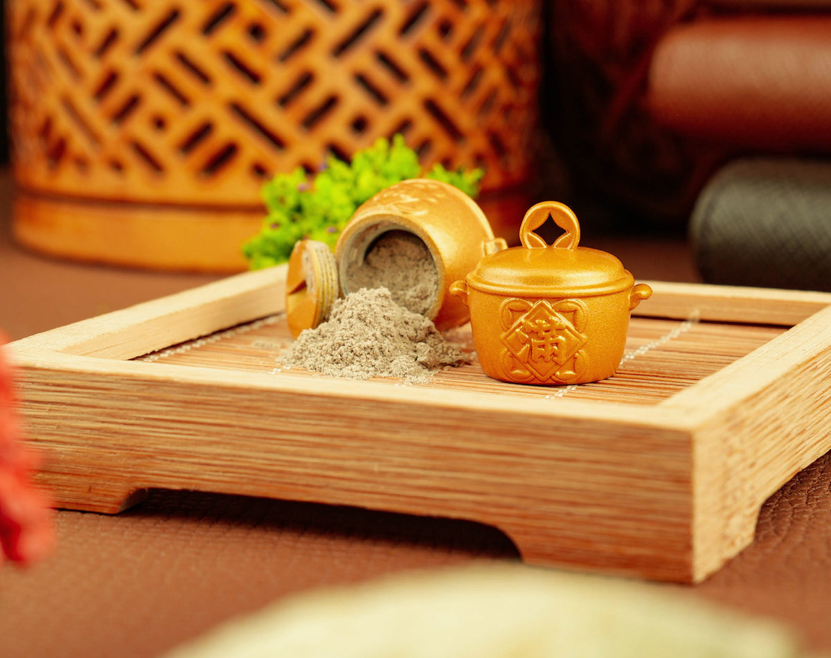 Golden Fortune Pot opened with temple incense ash