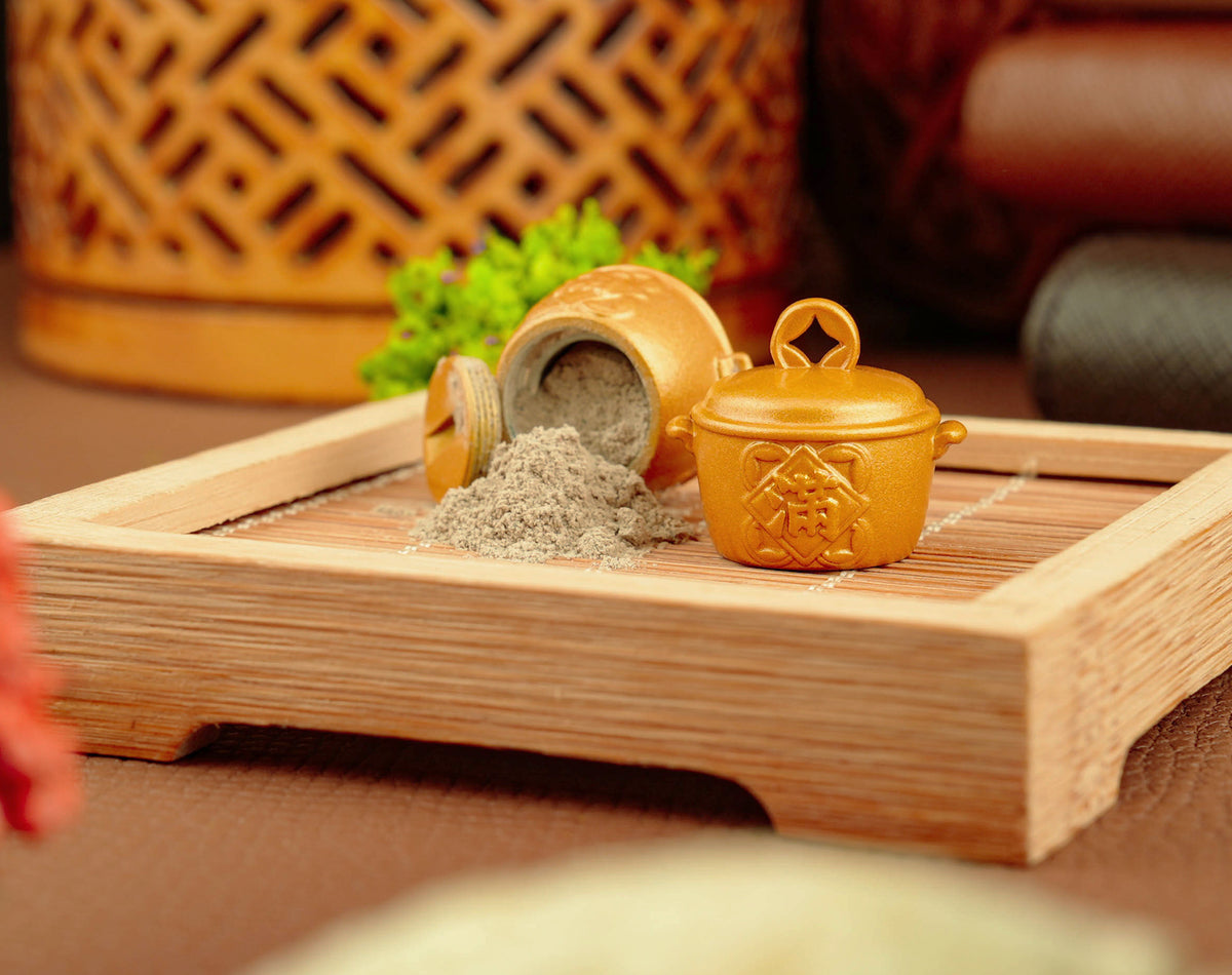 Golden Fortune Pot opened with temple incense ash