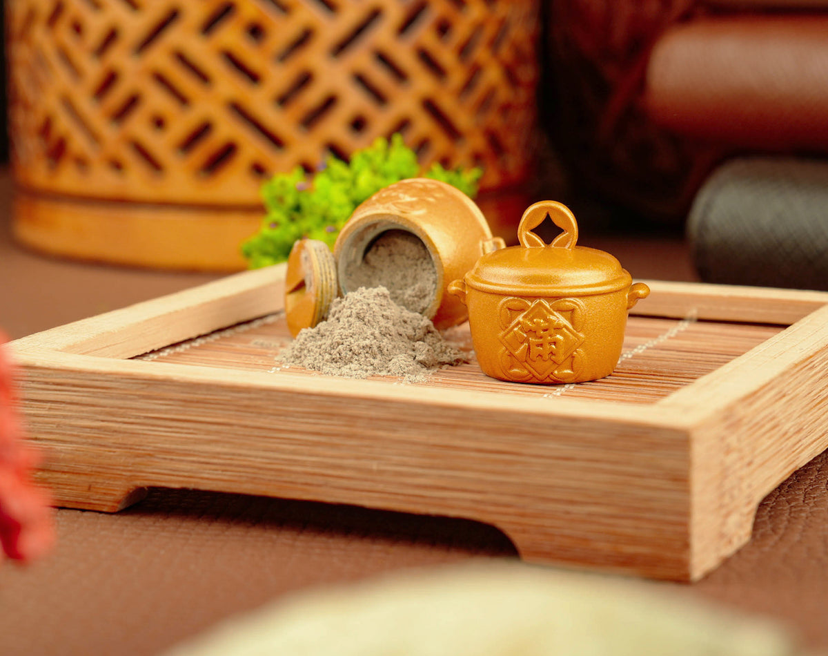 Golden Fortune Pot opened with temple incense ash