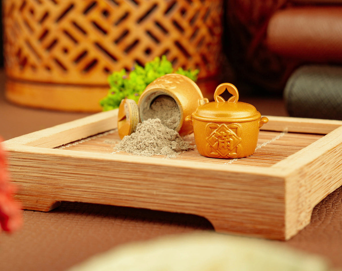 Golden Fortune Pot opened with temple incense ash